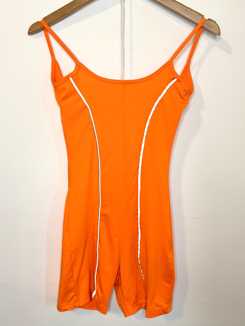 Orange one piece romper with reflective detail
